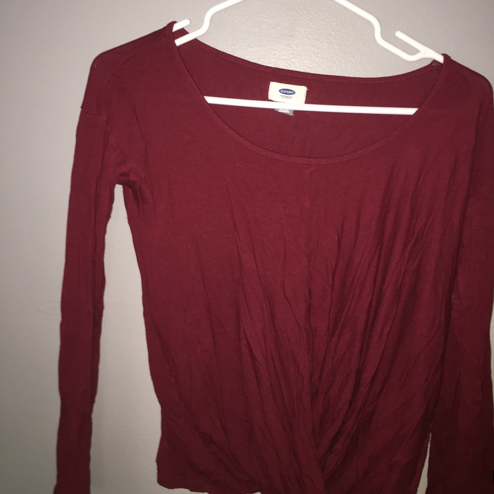Burnt red tunic folded shirt.